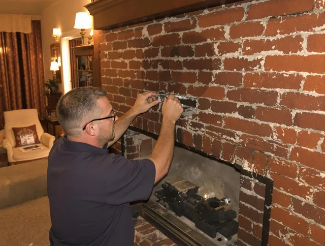 Mahoning Chimney Sweep expert fixing a fireplace in Mahoning, OH